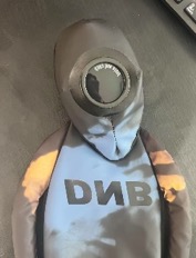 Off-white discolored little alien with cone eyes